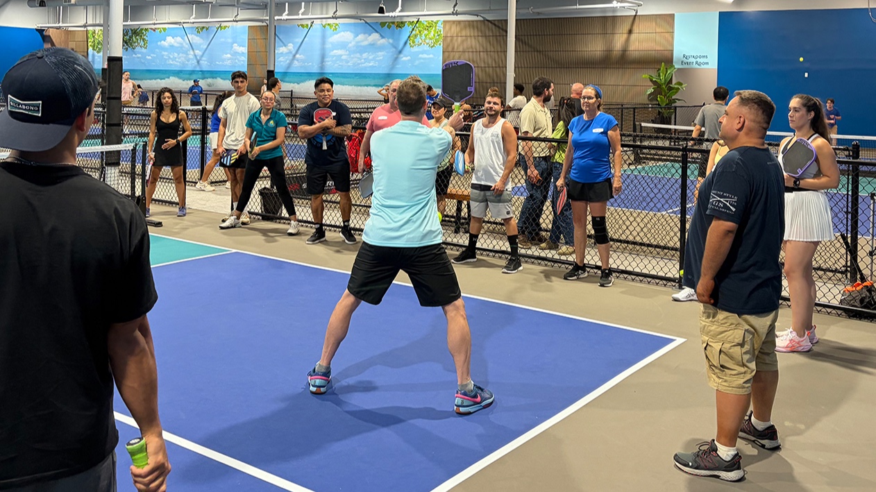Coach Jason giving instruction to a special event group.